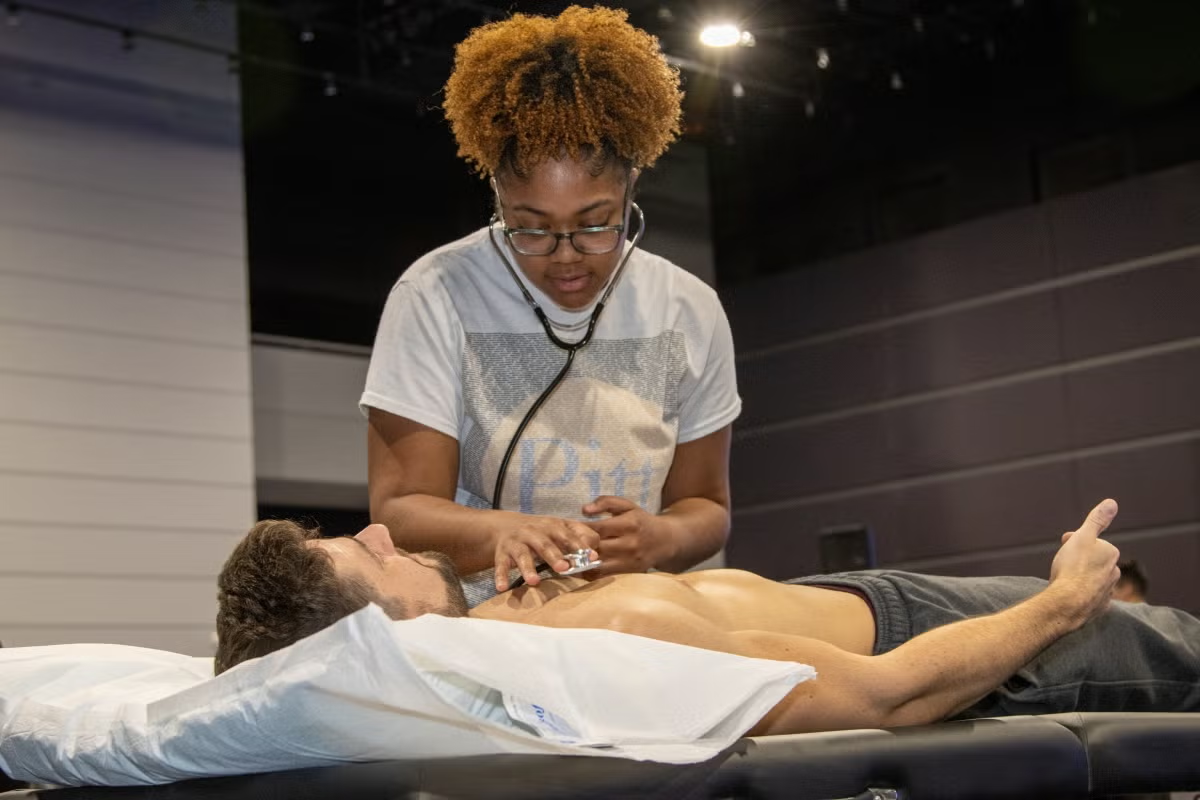 Student practicing in a clinical training environment